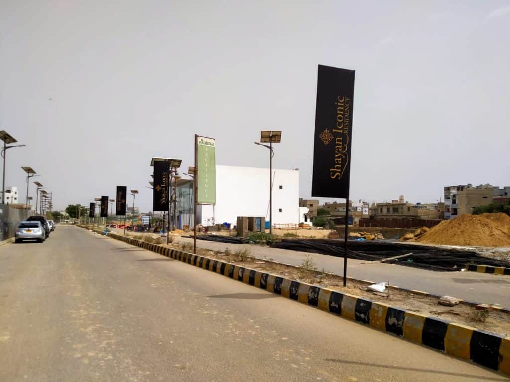 Pole banner installation with brackets and stainless banding
