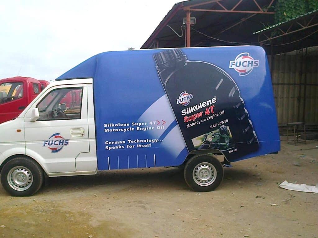 Commercial van branding with engine oil advertisement wrap