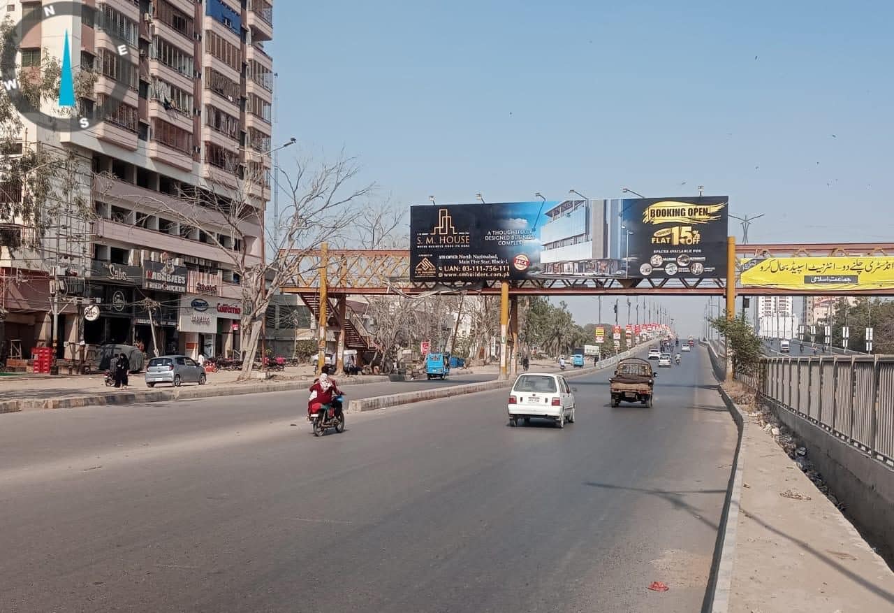 SM House pedestrian bridge branding designed for high visibility in a busy Karachi location