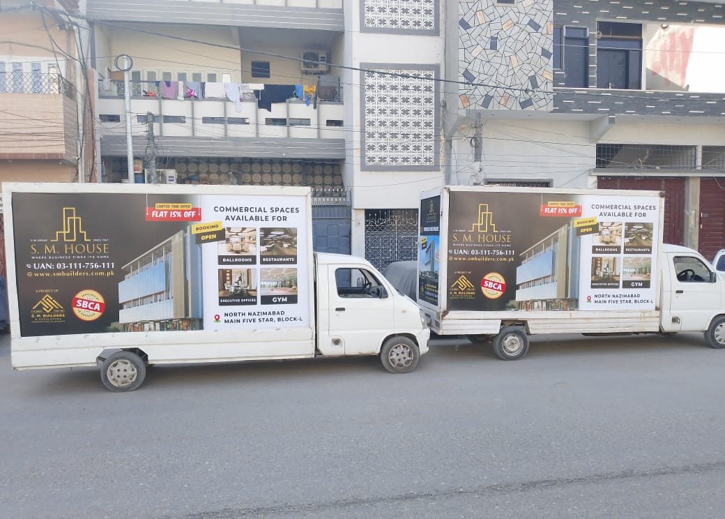 SM House vehicle advertisement with creative visuals traveling through Karachi’s streets for maximum reach