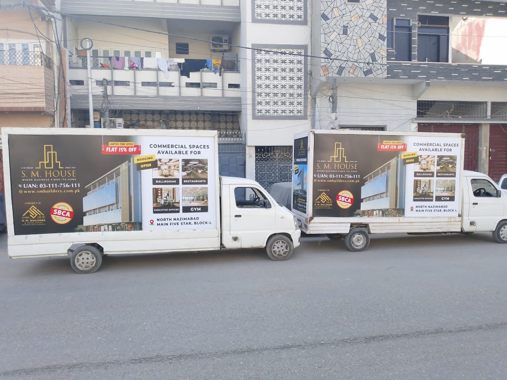SM House vehicle advertisement with creative visuals traveling through Karachi’s streets for maximum reach